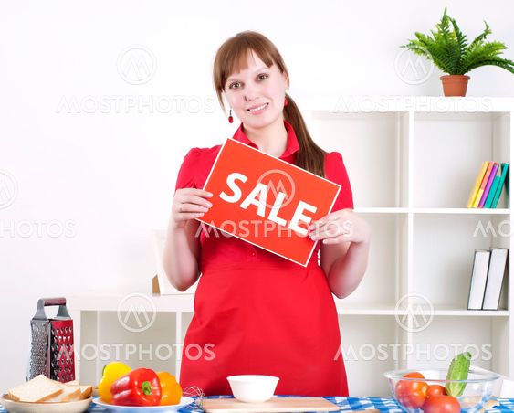girl holding sale sign