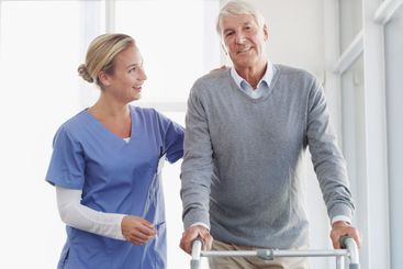 Happy nurse, elderly patient and walker with support for...