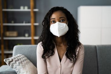 Woman On Coronavirus Quarantine In Protective Mask