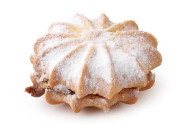 Traditional sweet pastry filled with nuts and covered in...