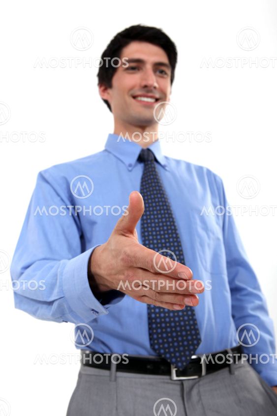 Businessman holding hand out