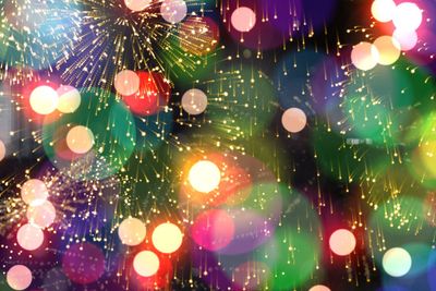 Colourful fireworks exploding on black background