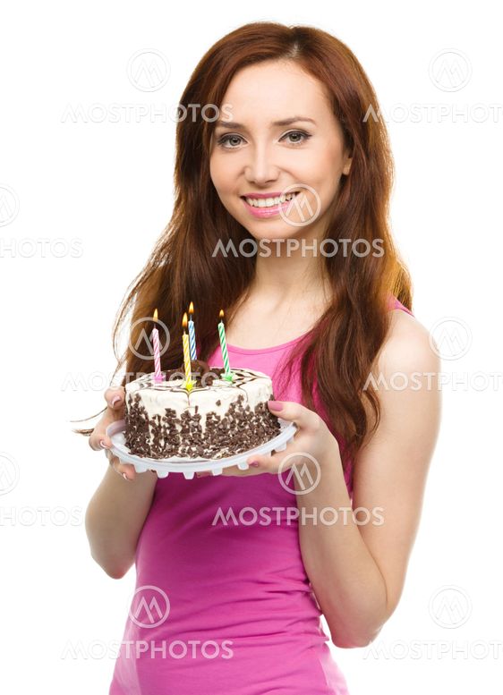 Young woman with anniversary cake
