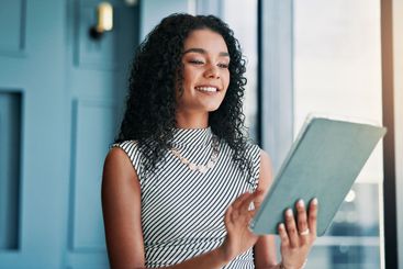 Smile, business and woman on tablet in office for...