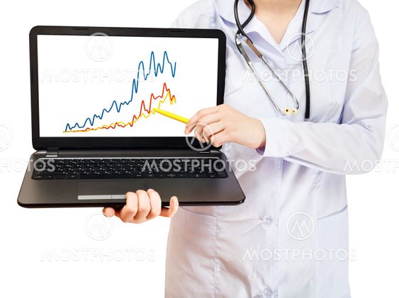 nurse holds computer laptop with charts on screen