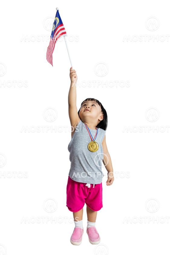 Asian Chinese little girl holding Malaysia Flag with gold...