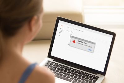 Girl looking at laptop with Operation Error on laptop...