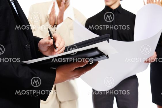Signing a document. People at business meeting. Studio shot