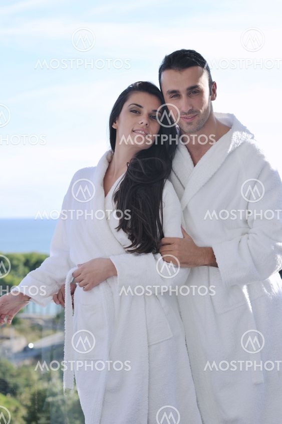 couple relaxing on balcony