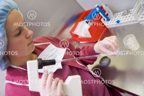 Embryologist processing sample