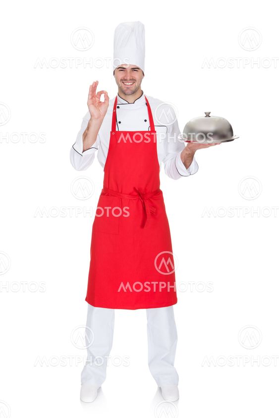 Portrait of cheerful chef with silver tray