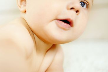 Baby, boy and crawling on carpet in home, learning and...