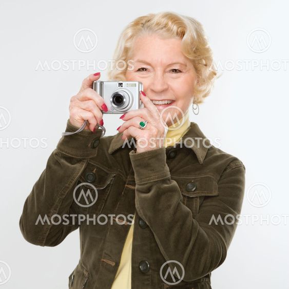 Woman using digital camera.