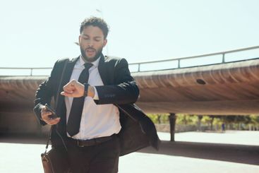 Outdoor, businessman and rush with watch for time,...