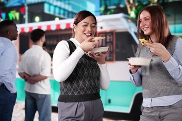 Group Of Friends Having Fun Eating Street Food