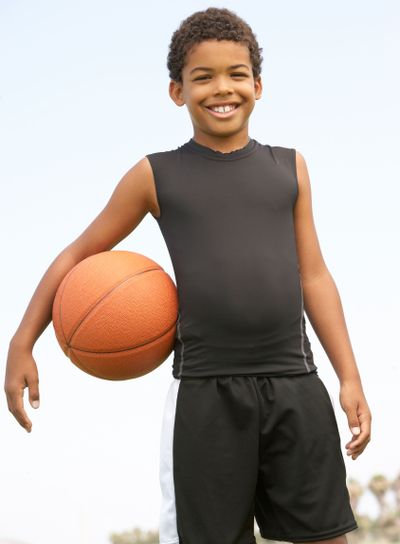 Young Boy Playing Basketball