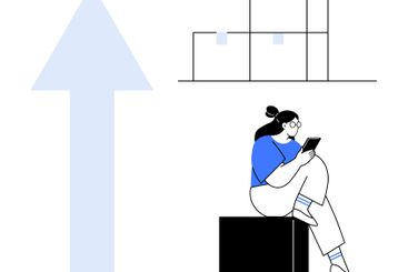 Woman with smartphone sitting on box, large upward...