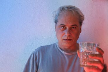 portrait with copy space of mature man with ambient...