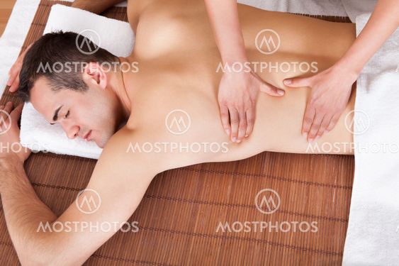 Young man getting shoulder massage