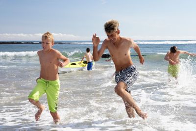 Teenagers playing on beach