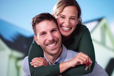 Happy Couple Holding Home Keys