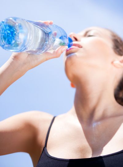 Fitness woman drinking water
