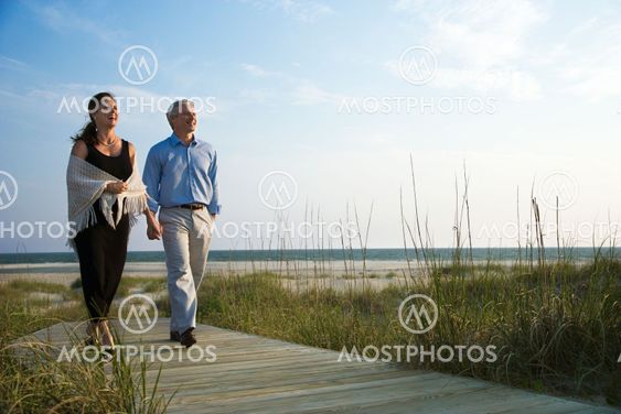 Couple holding hands.