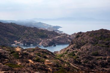 rocky coastline with bay and cove with boats