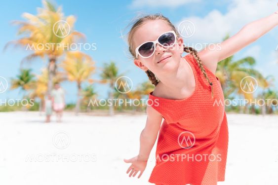 Closeup of adorable little girl during beach vacation...