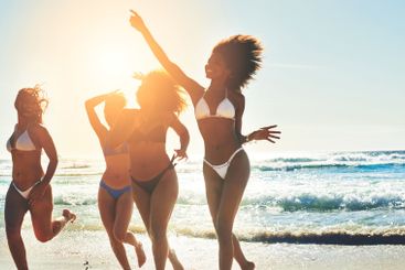 Women, students and freedom in ocean for travel, excited...