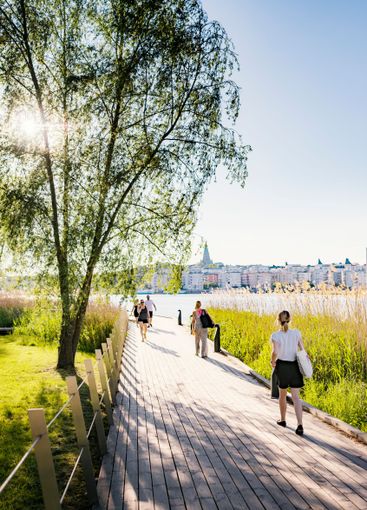 Pedestrians walking on boardwalk in Stockholm, Sweden