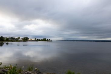 River during sunset on a cloudy evening in Ottawa,...