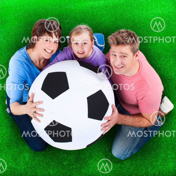 Family holds soccer ball