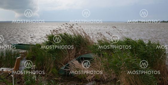 rural landscape with boat in storm