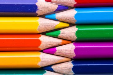 Colorful arrangement of colored pencils in various...