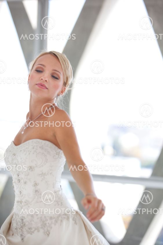 blond bride framed in a window