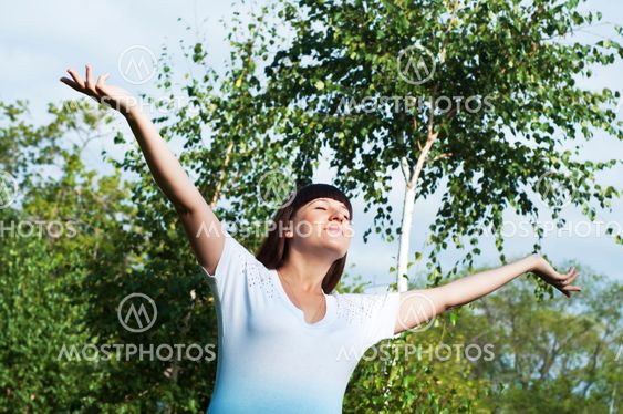 Young happy woman in park