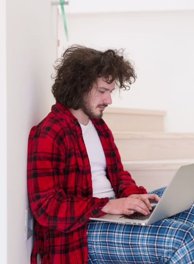freelancer in bathrobe working from home