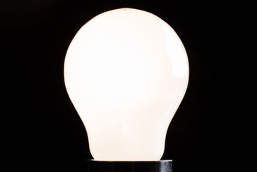 Close-up of electrical bulb on black background