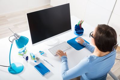 Businesswoman Using Computer On Desk