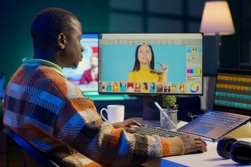 Freelance graphic designer working from home office on...