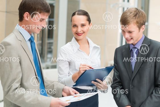 Business people discussing reports