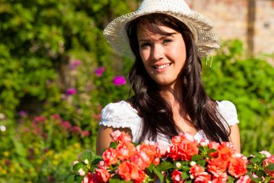Gardening in summer - woman with flowers