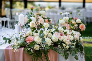 Elegant floral arrangements enhance the romantic...