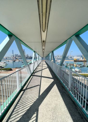 Perspective angle view of human bridge with sunlight and...