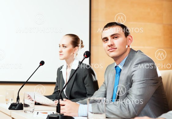 businessmen communicate at the conference