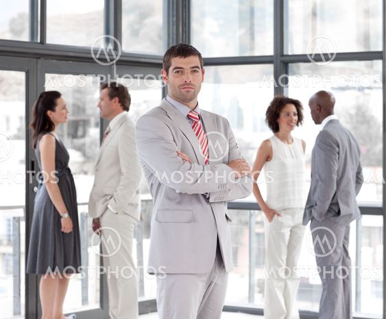 portrait of an attractive male manager leading his team