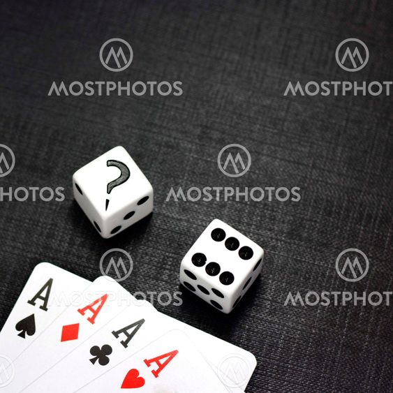 Dices and playing cards on a black background