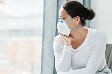 Woman, mask and window for covid, quarantine and...