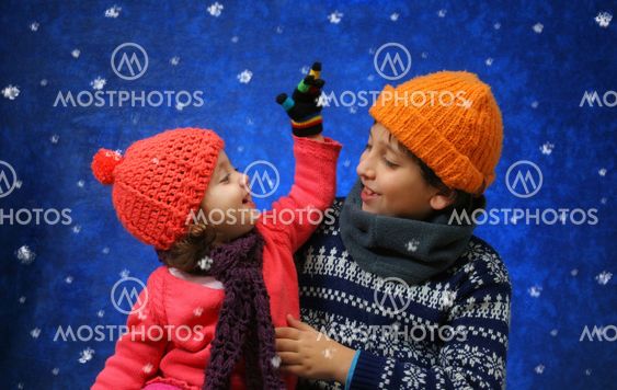 Brother and sister having fun in winter